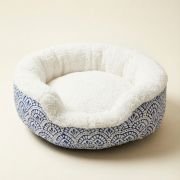 sherpa bolster dog bed showing premium white sherpa fur interior