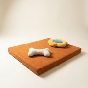 chew toys on orthopedic dog bed