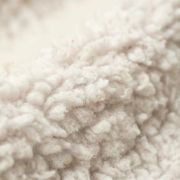 Close up of dog crate mat showing white sherpa fur