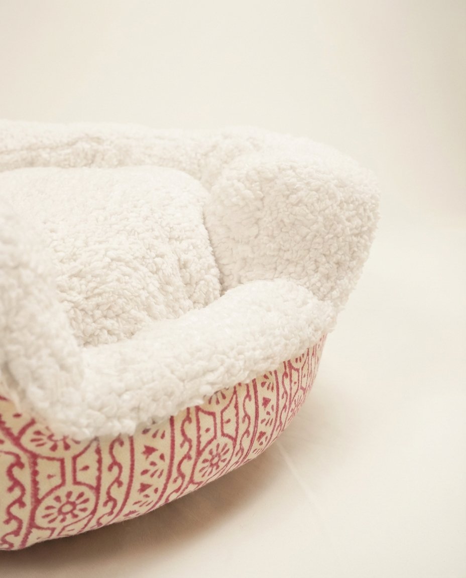 block print dog bed with pink handblock print canvas and white sherpa